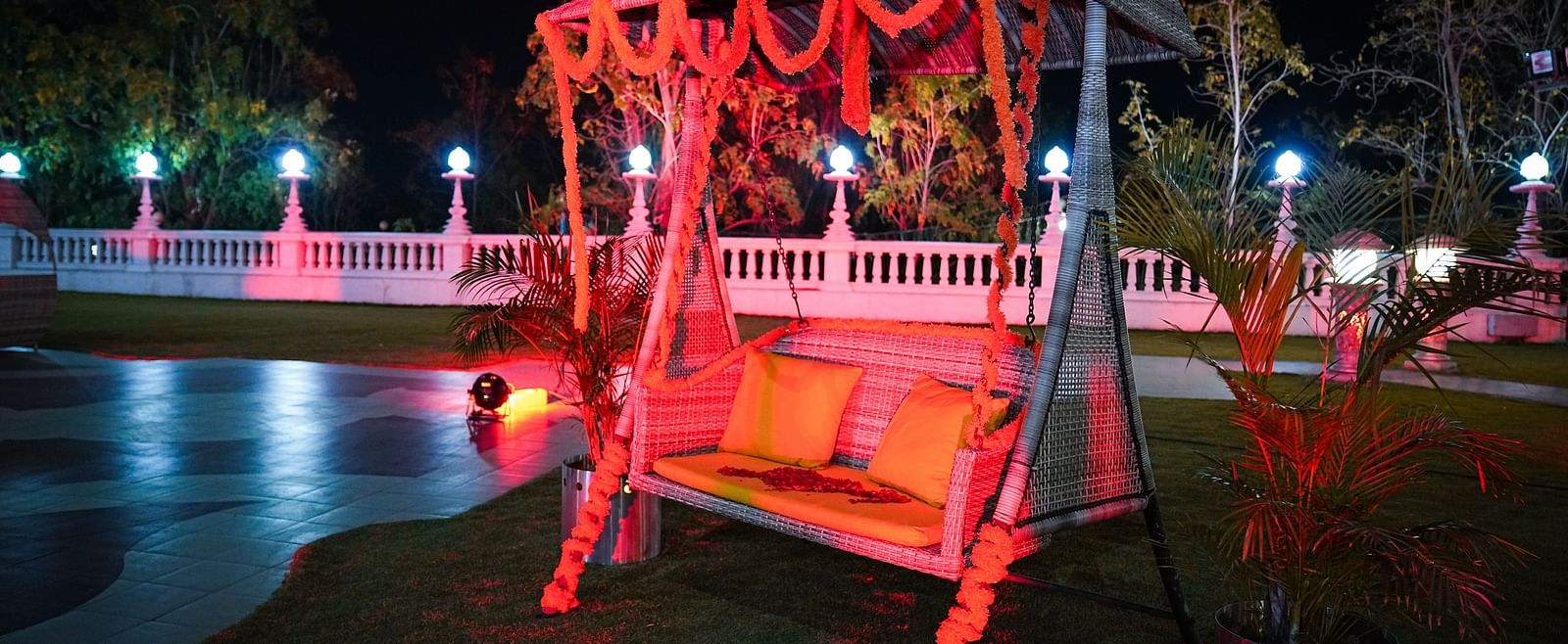 A swing on a lawn at night