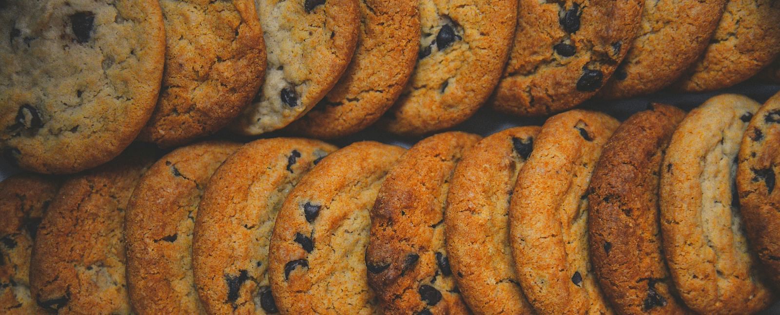 A tempting stack of golden chocolate chip cookies