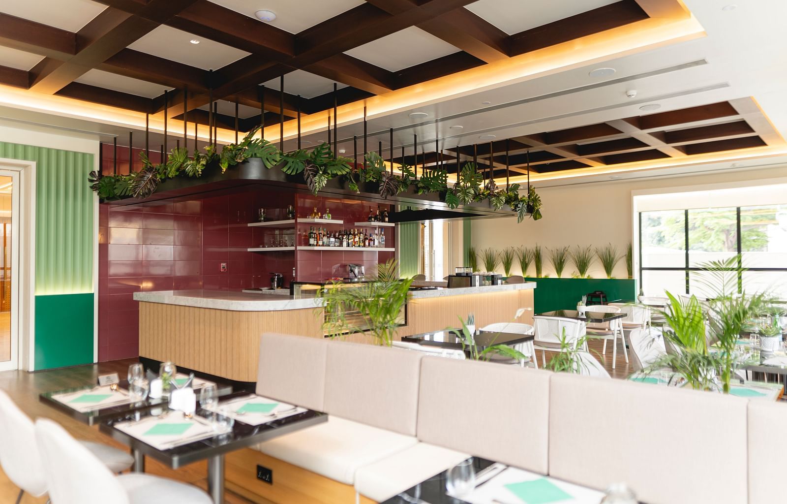 Meli-Melo Restaurant at KertelSuites, featuring elegant seating arrangements and stylish ceiling lights