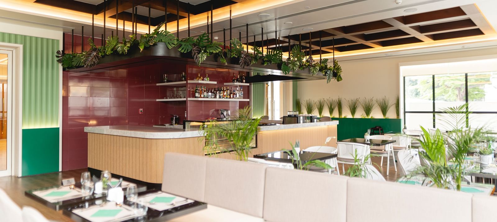 Meli-Melo Restaurant at KertelSuites, featuring elegant seating arrangements and stylish ceiling lights