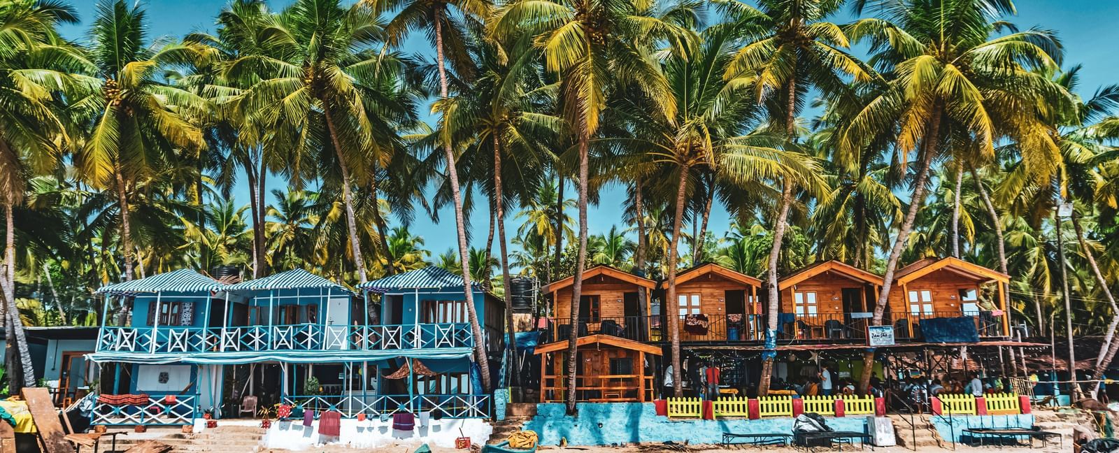 Calangute Beach in North Goa with sandy shoreline, coastal water, and beach houses along the stretch.