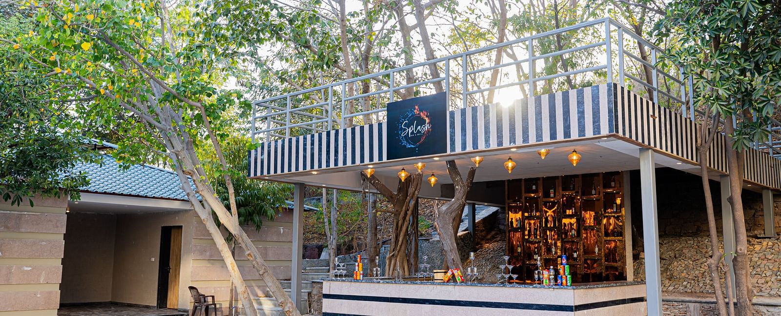 A view of Splash Bar and Grill counter placed outside at Essentia Luxury Resort & Spa, Udaipur.