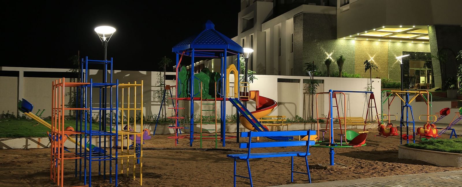 Kids play area at Dhanalakshmi Srinivasan Hotel, Perambalur with swings slides and other games.
