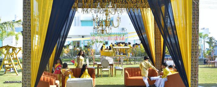 Outdoor sangeet lounge seating under clear sky