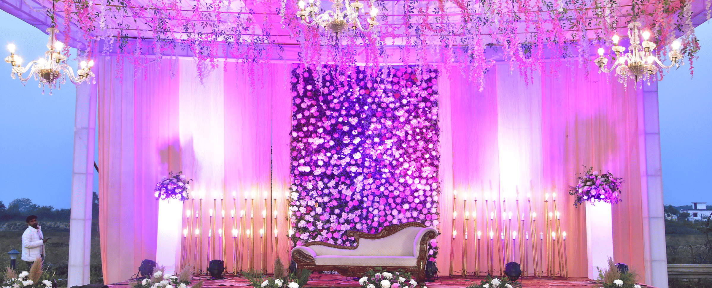 Grand wedding stage with floral backdrop at Vedikant Hotels & Resorts