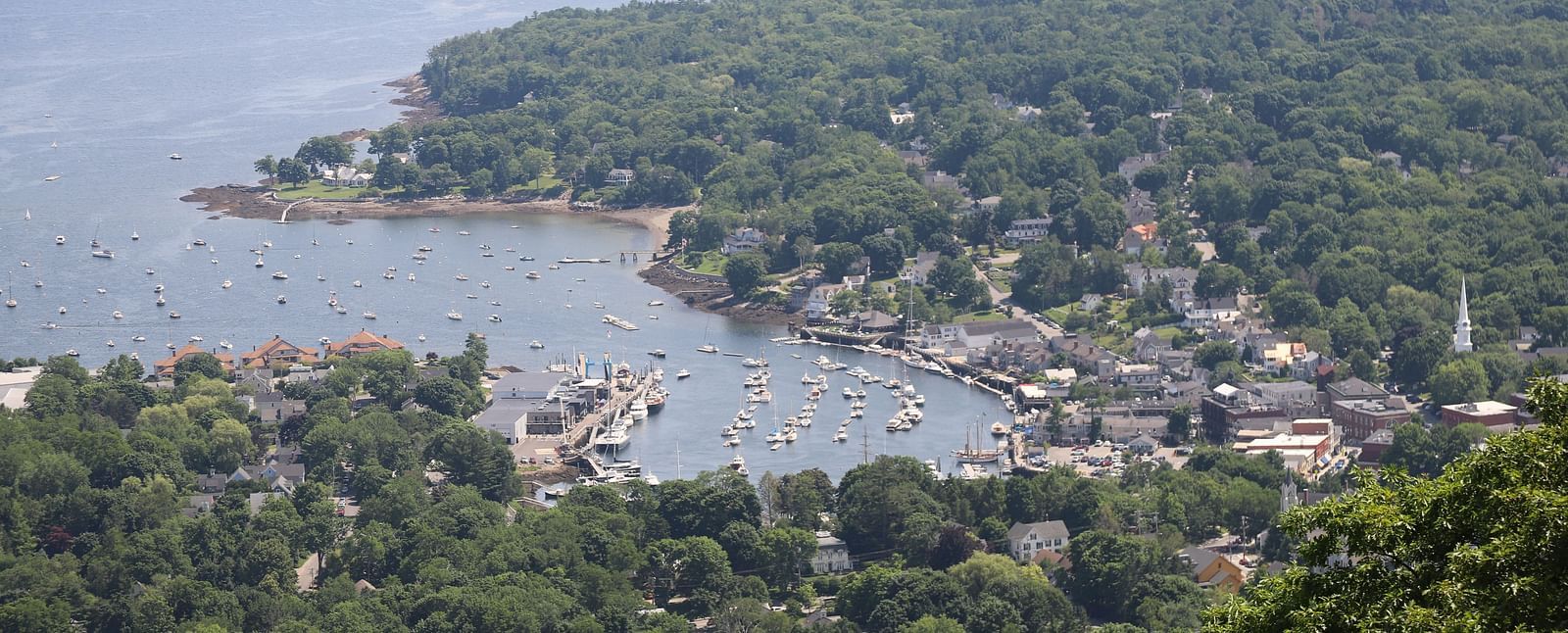 Aerial view of Camden Harbor and surrounding landscape near Hartstone Inn.