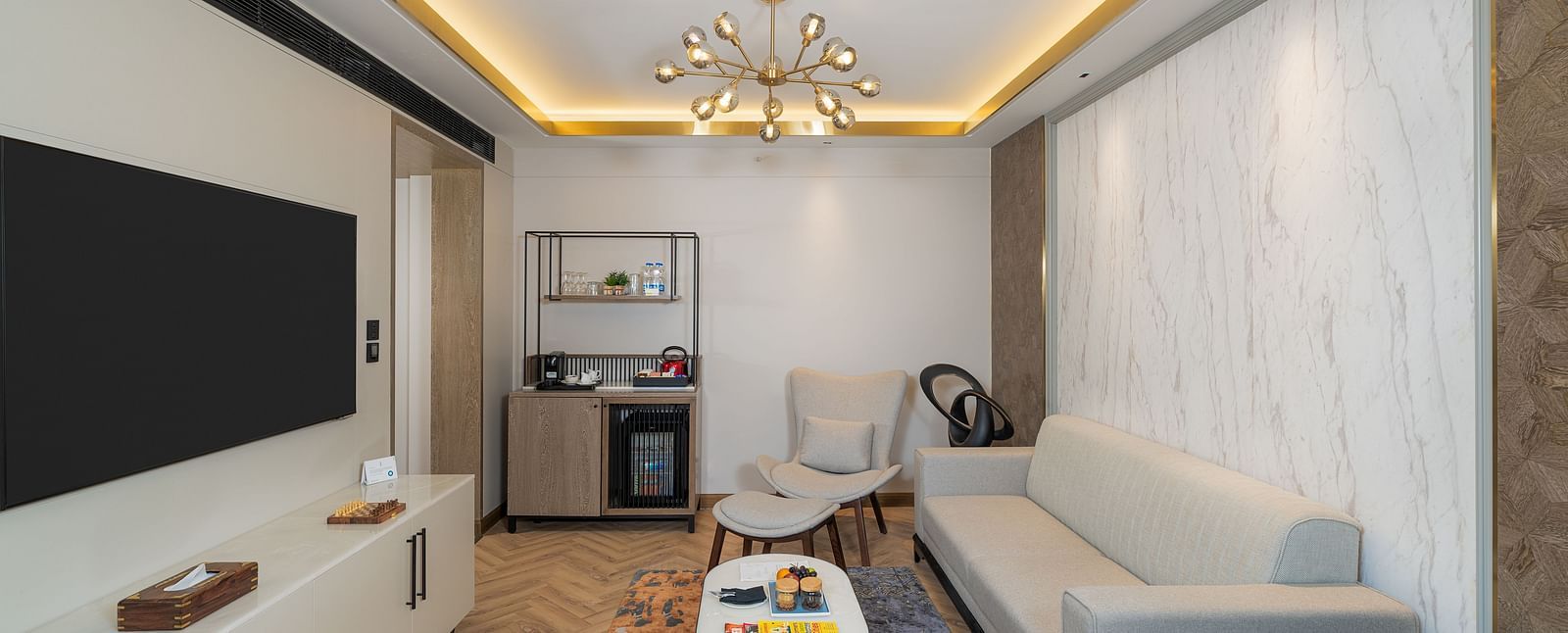 Nirvana Suite offering a dedicated workspace, a cosy seating area, and a convenient kitchenette  - Nirvana Luxury Hotel, Ludhiana