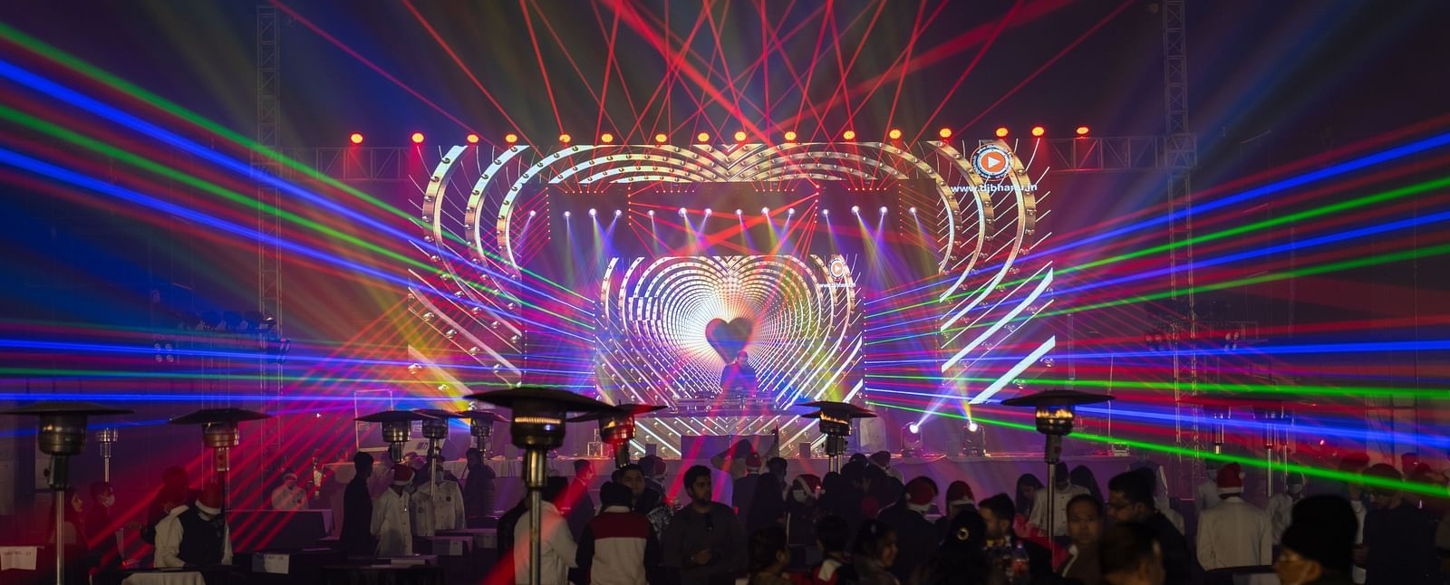 An event celebration with laser lights at Nirvana Luxury Hotel, Ludhiana.