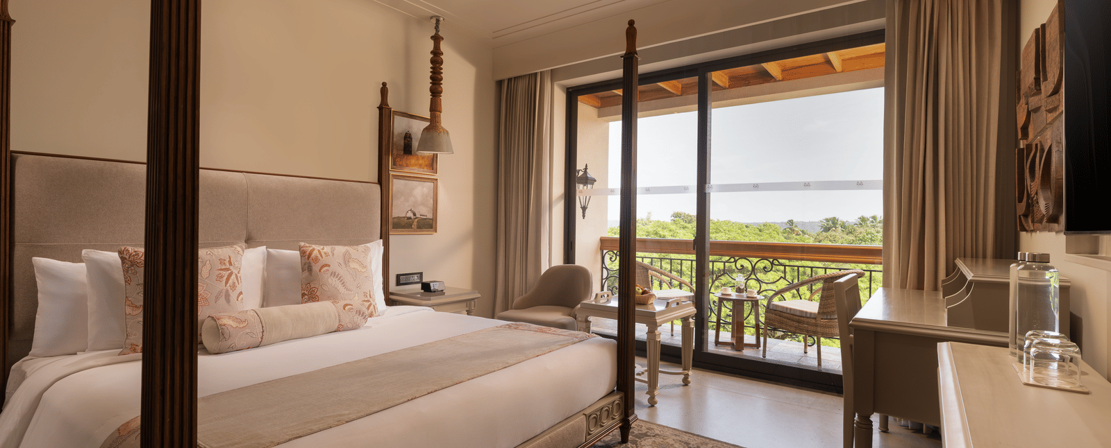 A corner-view shot of the Classic Room (Diwa) featuring a double bed along with a patterned rug placed in front of it at The Evren, Vagator.