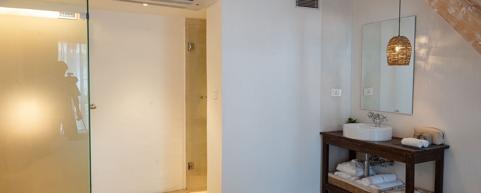 The deluxe loft room washroom area with toiletries and the shower - The Nanee