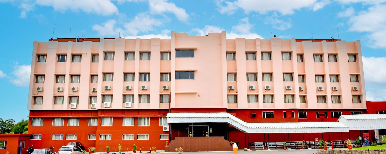 A long shot of the facade of Hotel Sahara in Ramoji Film City - Scenic Hotel Exterior in Hyderabad.