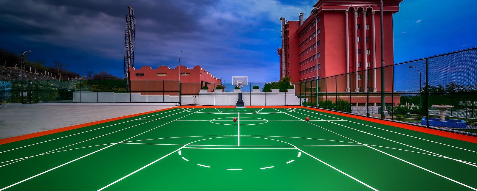 A shot the basketball court during dusk at Tara, Comfort Hotel in Hyderabad - Ramoji Film City.