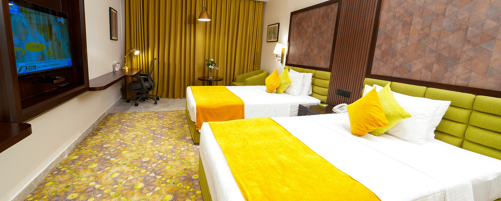 Room at Sitara Luxury Hotel in Hyderabad near Ramoji Film City with a double bed and a television