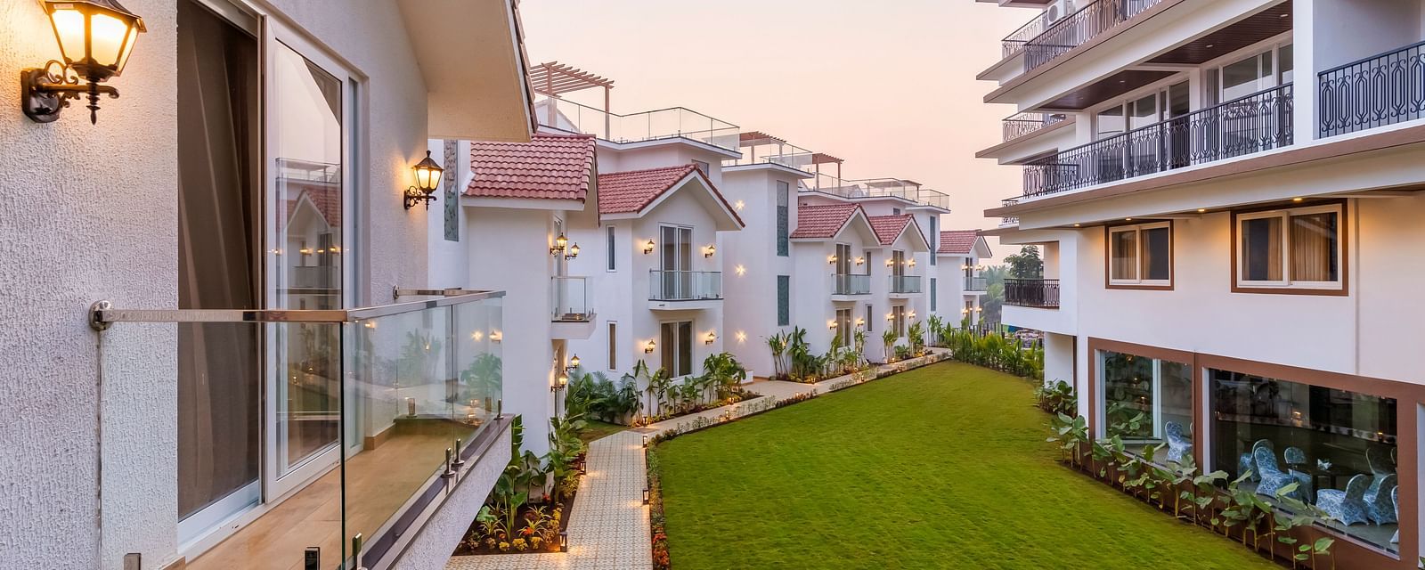 Rooms view with a manicured garden in front of it - The Tanisi Hotels & Resorts, Goa