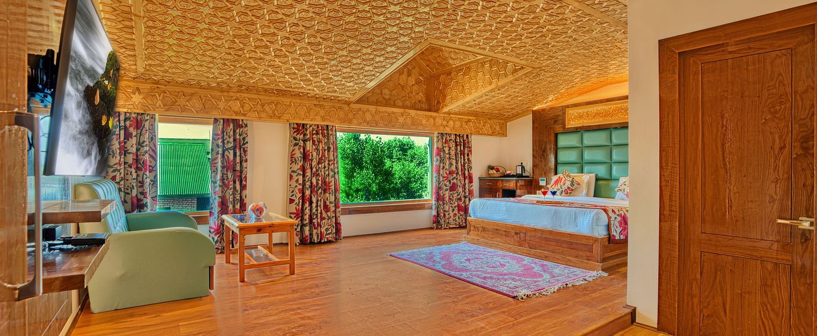 Luxurious room at Royal Comfort Regency with wide open layout and plush furnishings, perfect for extended stays.