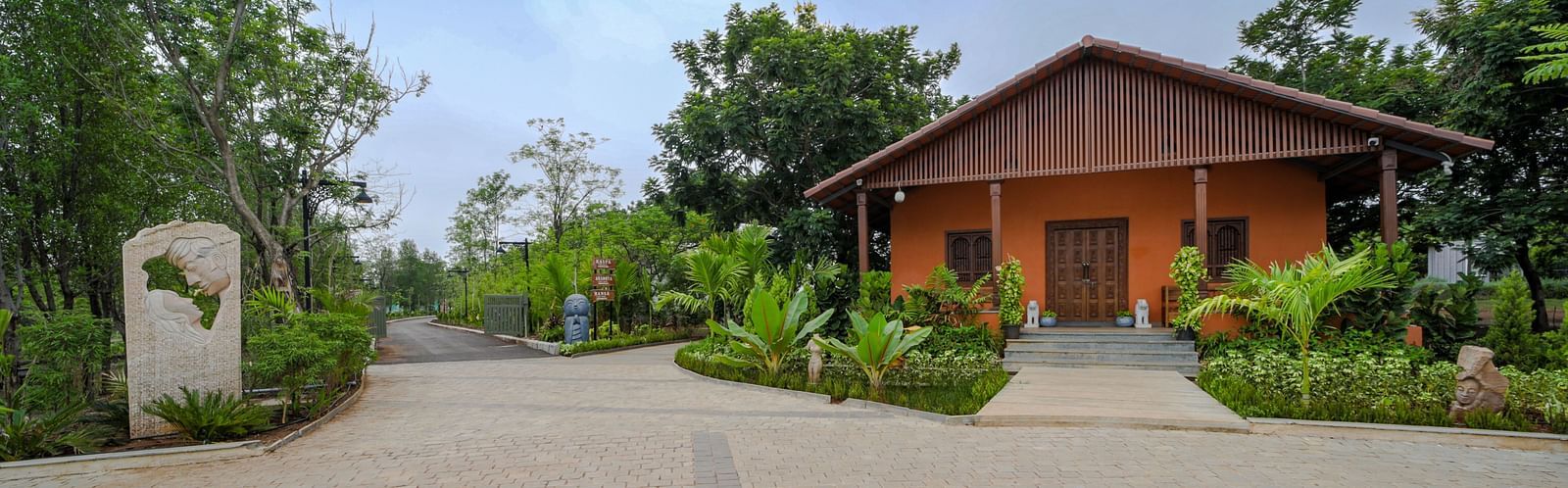 A facade image of a pathway leading to a cottage at the resort - Trance Veechika Resort, Vikarabad
