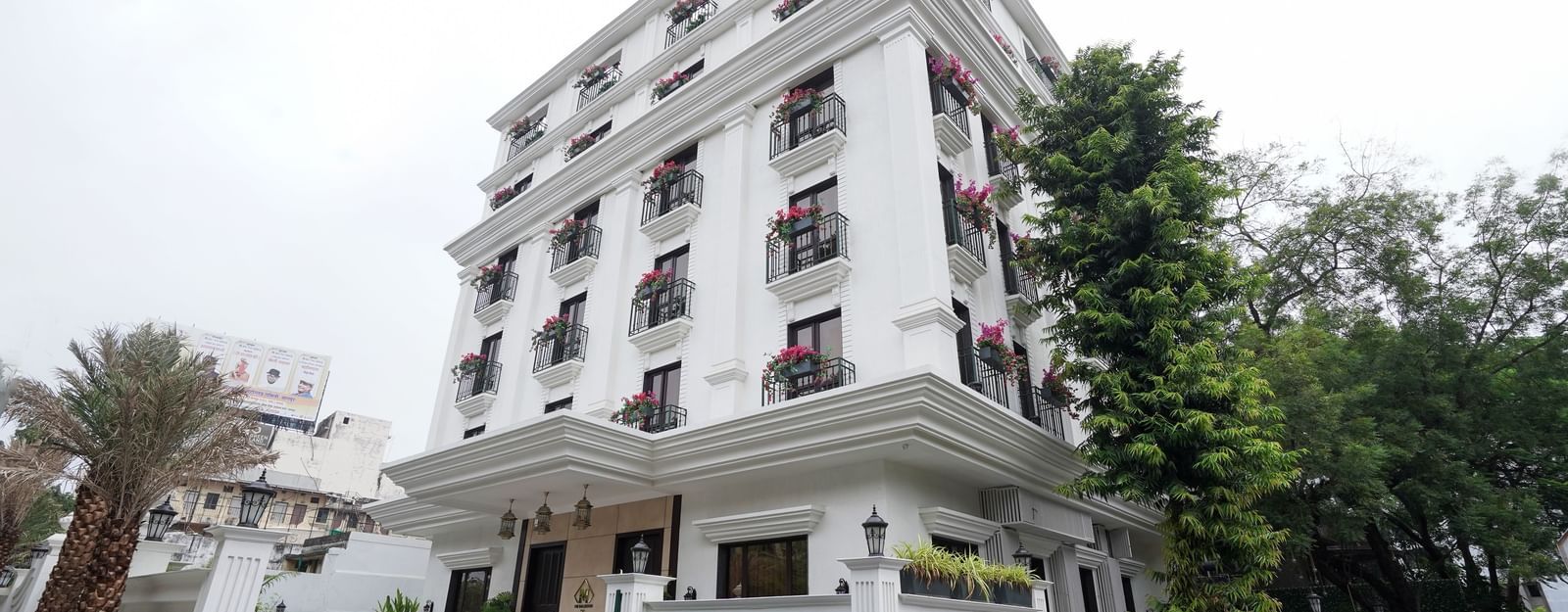 Corner view of M2 Square by Monday Premium featuring a drive way in front of the entrance to the hotel.