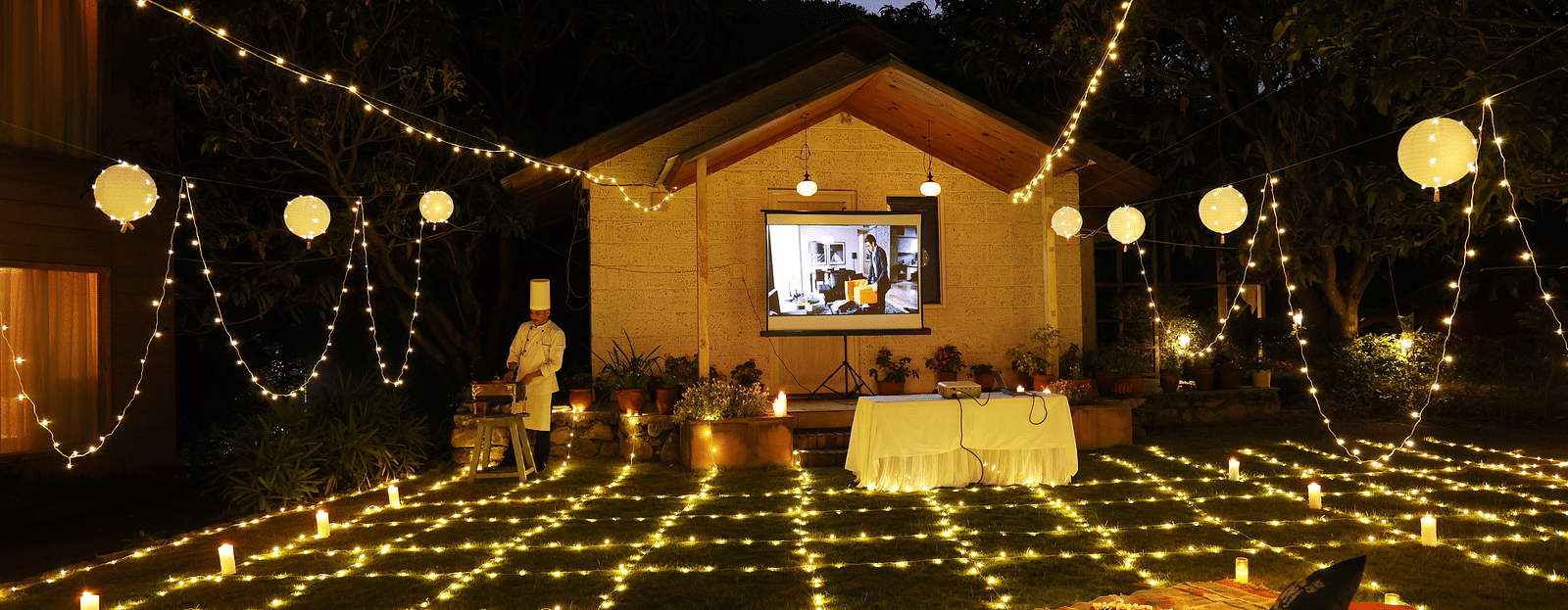 A lavish movie night set up at night at The Sylvan Retreat, Dehradun.