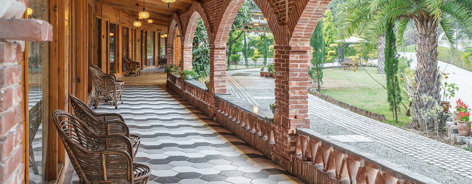 The hallway of the entrance at The Sylvan Retreat, Dehradun with chairs facing the view.