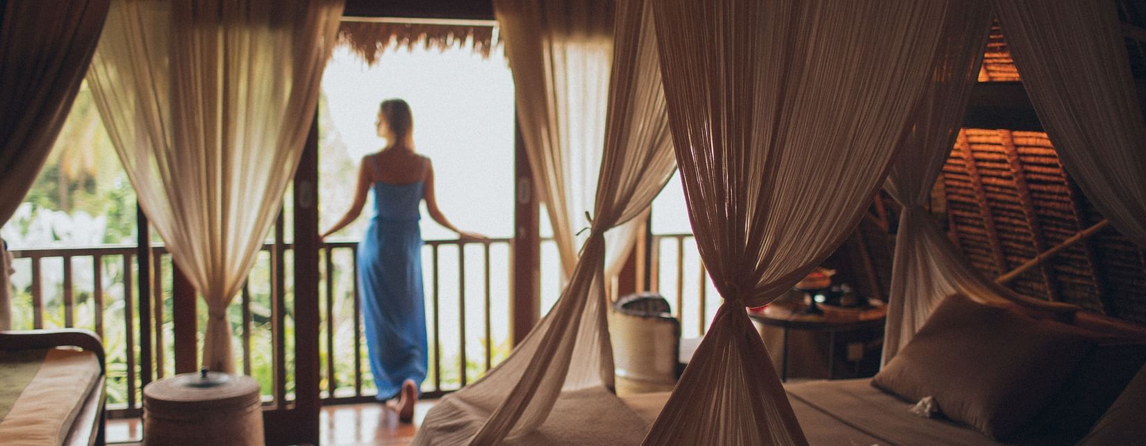 woman looking outside the balcony