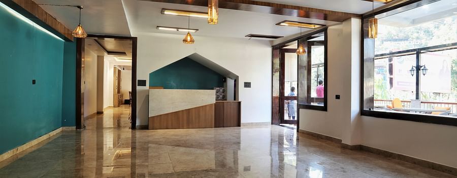 A spacious hall with large windows and soothing ambient lighting - Vinsober Monal, Nainital