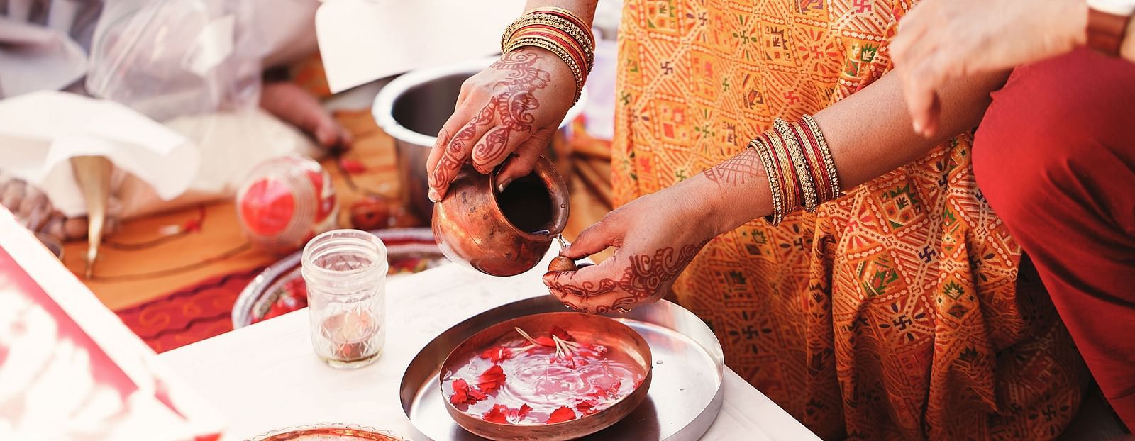 An image capturing a close-up of an Indian wedding ritual.