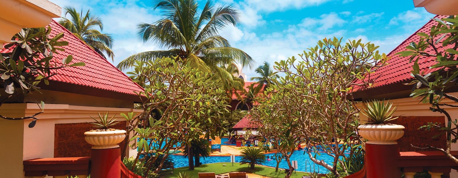 entrance to Caravela Beach Resort Goa with the swimming pool in the background