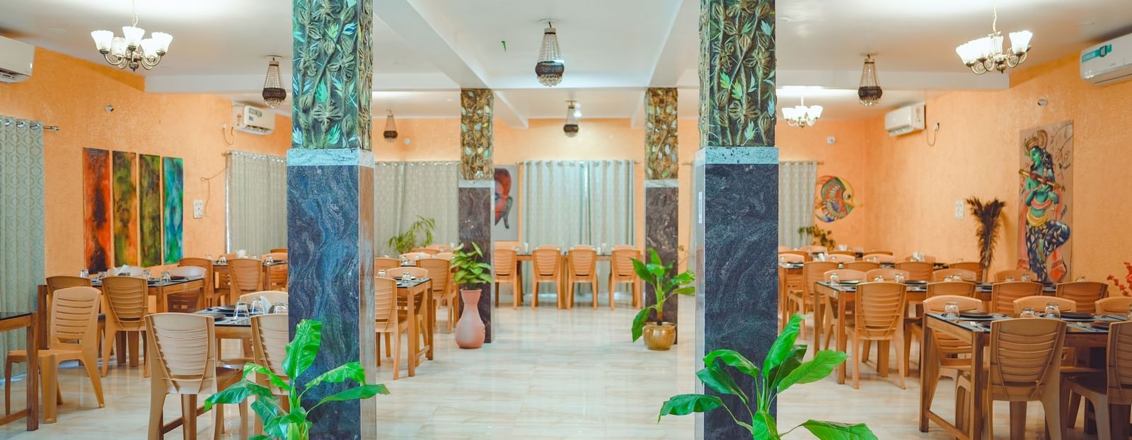 front view of the restaurant at dip holidays with green plants in the entrance