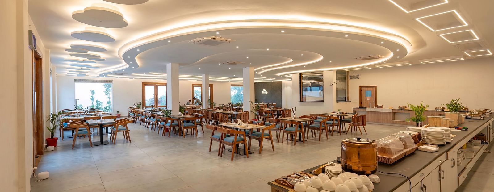 A dining room with a buffet table and seating arrangements.