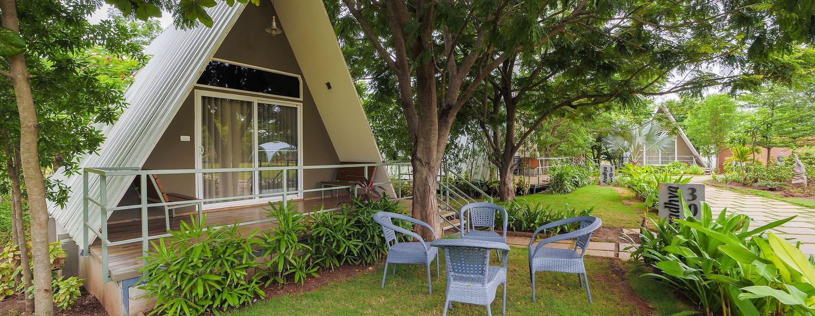 An image of Aradhya Room with outdoor seating in the lawn - Trance Veechika Resort, Vikarabad 