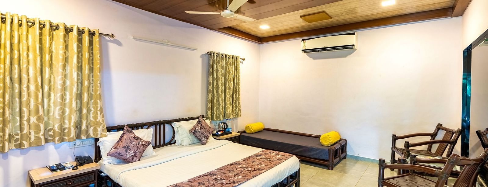 A room with with a double bed and seating arrangement at Saavaj Resort