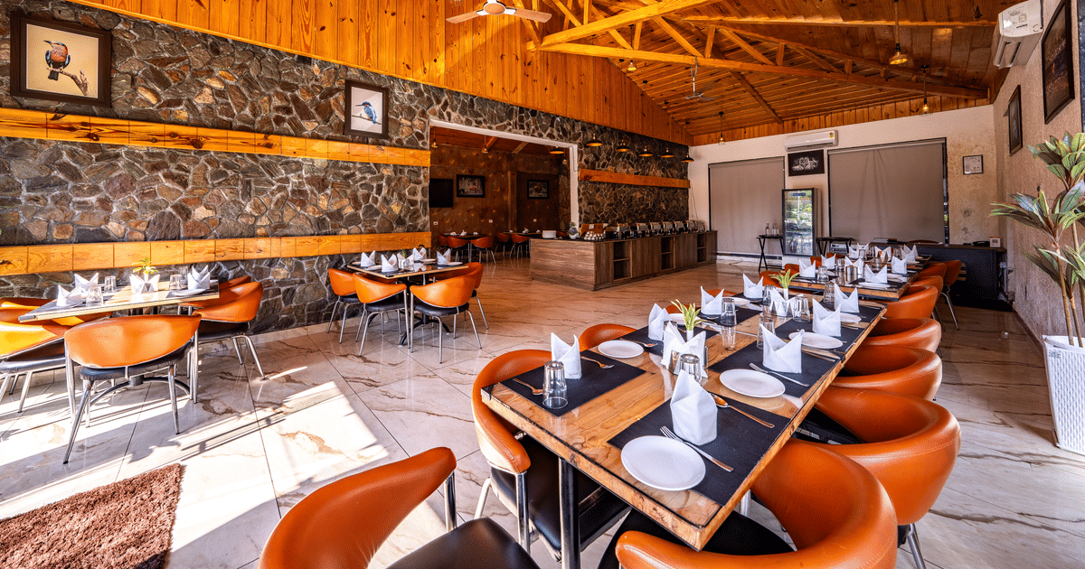 Spring Restaurant dining hall with timber ceiling at Corbett Nirvana