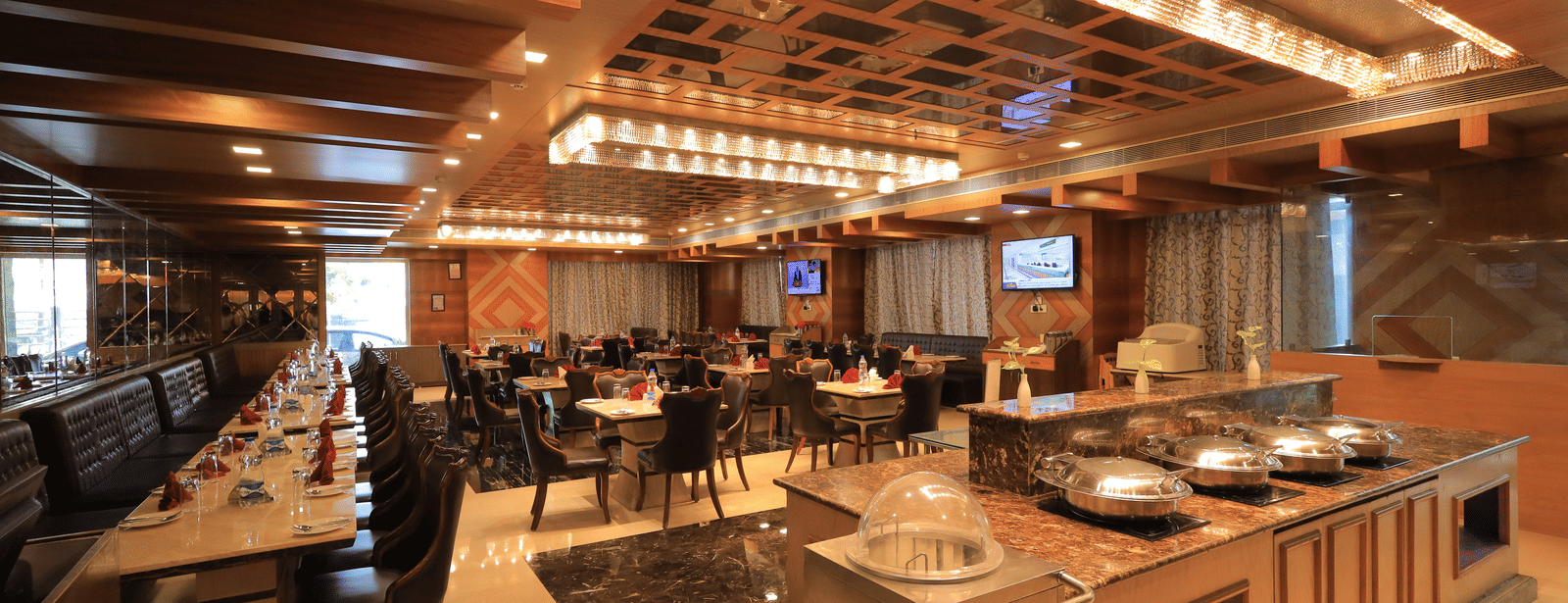 Corner-view shot of the Porchae restaurant featuring a buffet counter overlooking the elegant dining area.