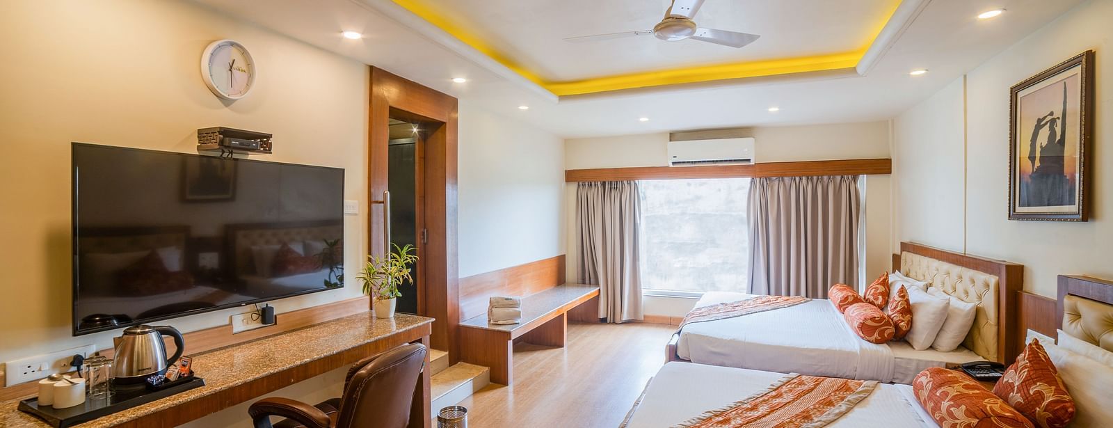 Family Room featuring two lare beds with interior decor. - Hotel Ashok Nagpur