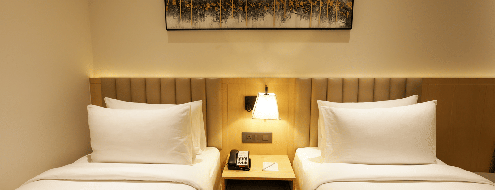 Comfortable  bedroom with elegant decor and bedside lamps at Ramada by Wyndham Sonipat Murthal