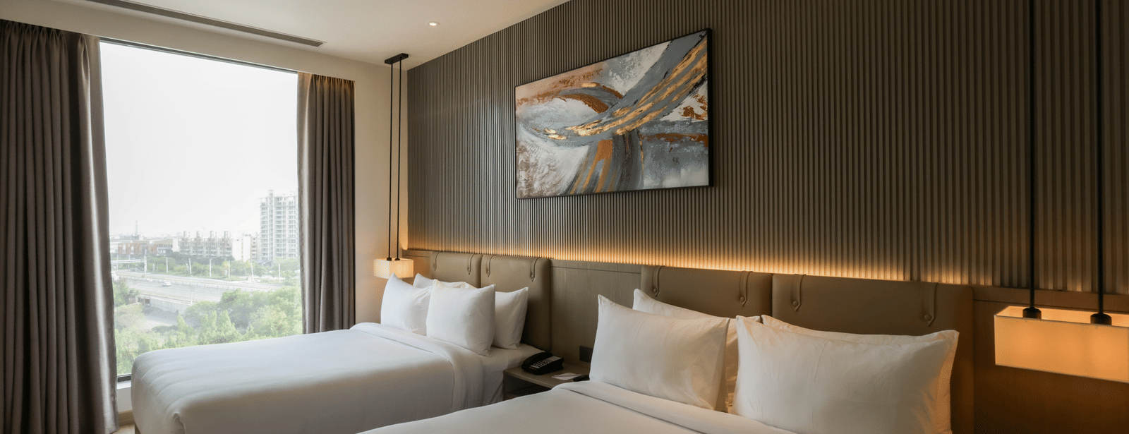 Bright room with a large window and scenic outdoor views at Ramada by Wyndham Sonipat Murthal