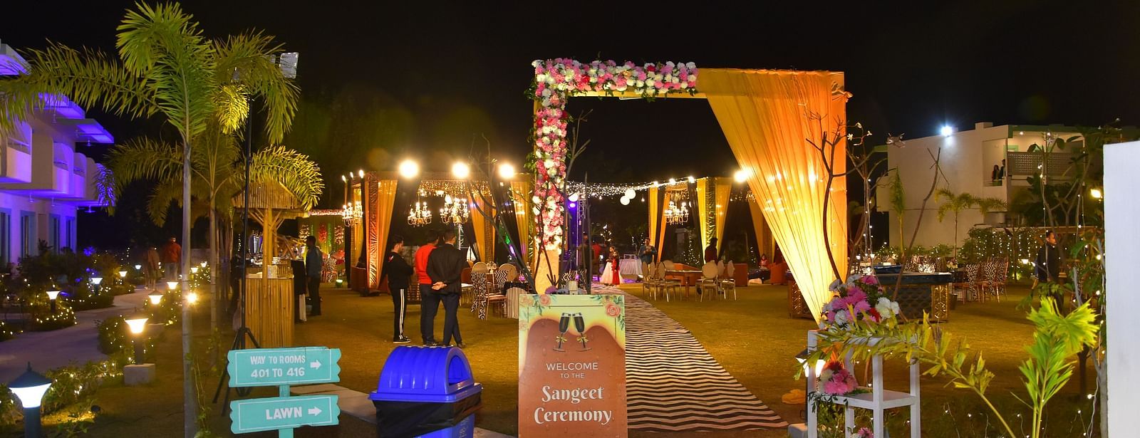 Nighttime entryway decor for a wedding event at Vedikant Resorts The Mallard Corbett.
