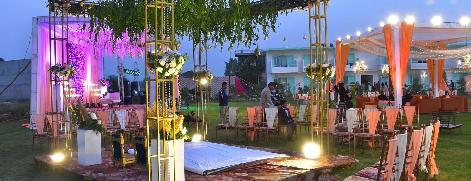 Evening wedding lawn decor with floral lights and canopy at Vedikant Resorts The Mallard Corbett.