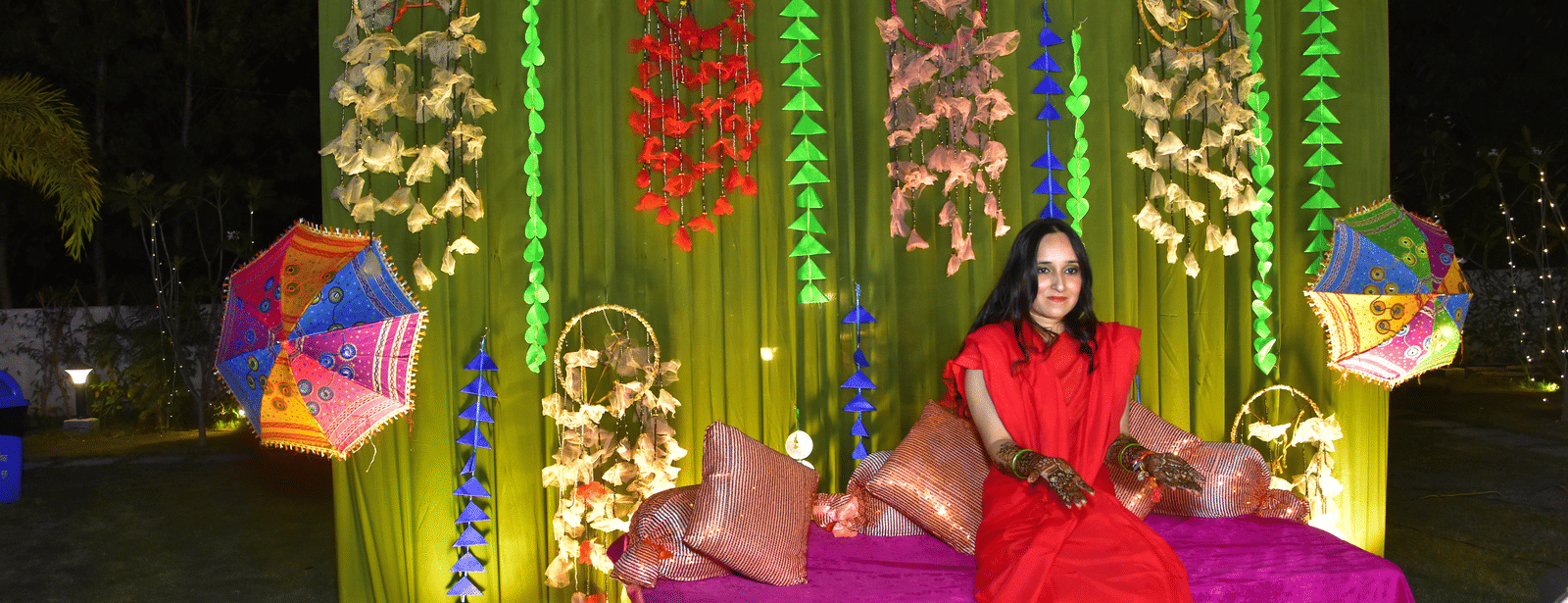 Bride posing amidst a vibrant floral wedding setup at Vedikant Resorts The Mallard Corbett.