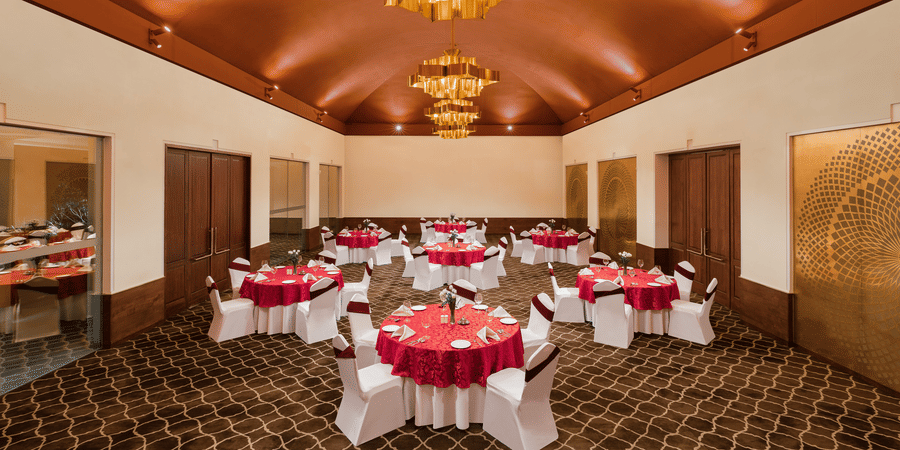 The dining arrangement at a spacious banquet hall