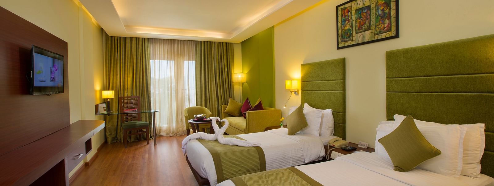 twin beds placed in Superior Room at Hotel Atithi - TGI Grand, Pondicherry