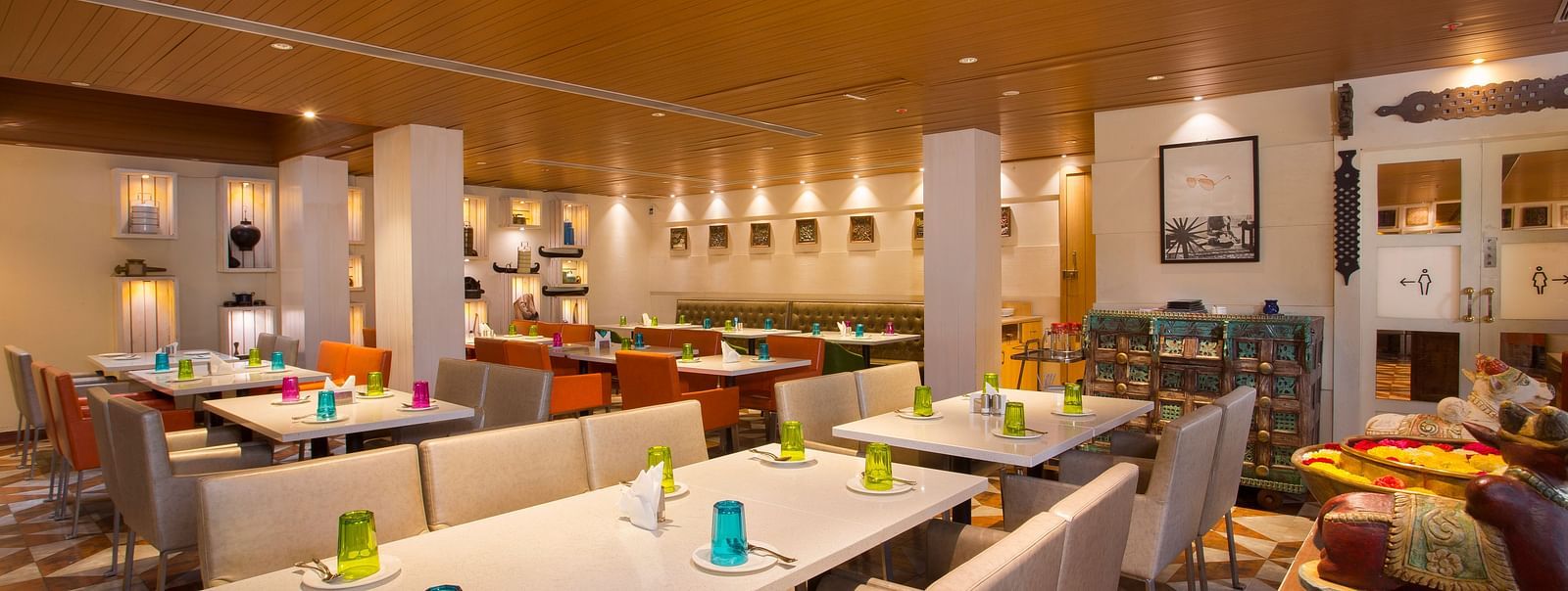 view of a restaurant with rows of rectangular tables with chairs on the long sides - Hotel Fountain Tree By TGI - JP Nagar, Bangalore