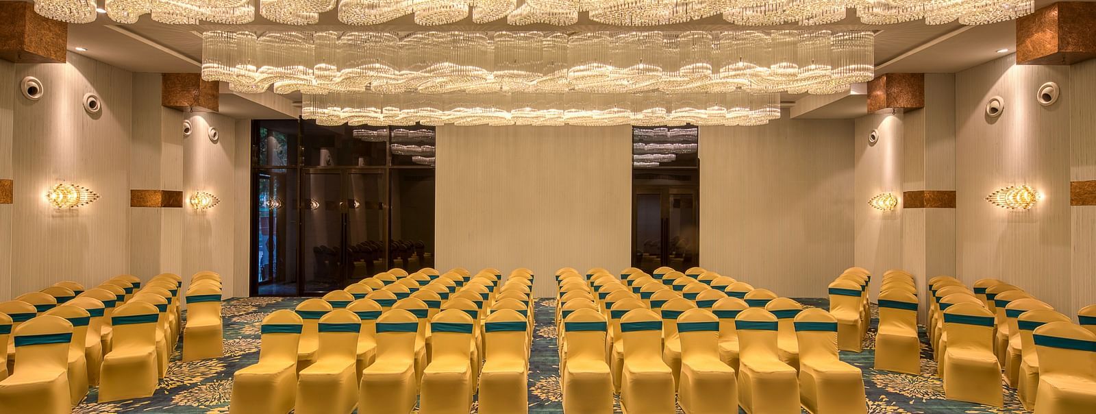 Yellow coloured chairs in the Sumo Anaika Banquet Hall at Le Foliage by TGI, Bangalore