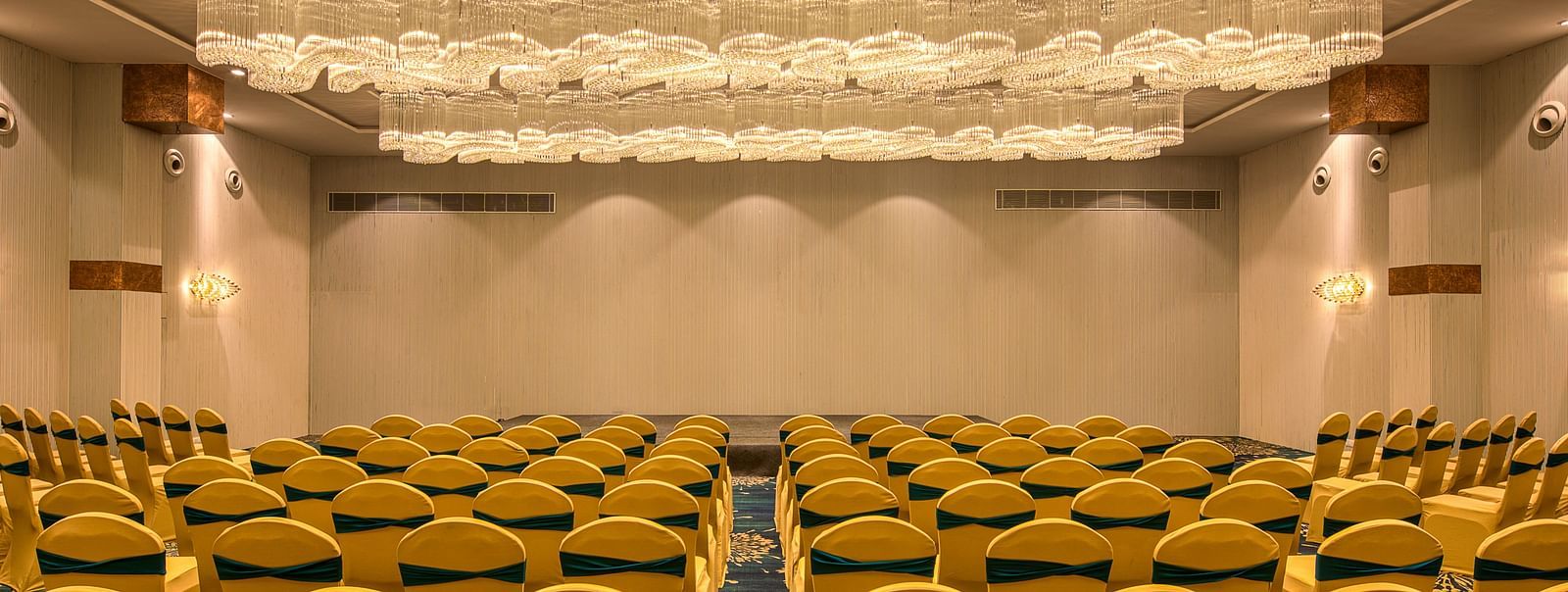 Yellow coloured chairs in the Sumo Anaika Banquet Hall at Le Foliage by TGI, Bangalore
