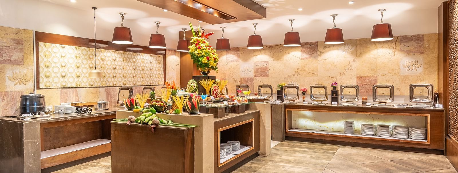 Buffet counter in a hotel restaurant decorated with fresh flowers- TGI Grand Fortuna, Krishnagiri Main Road, Hosur