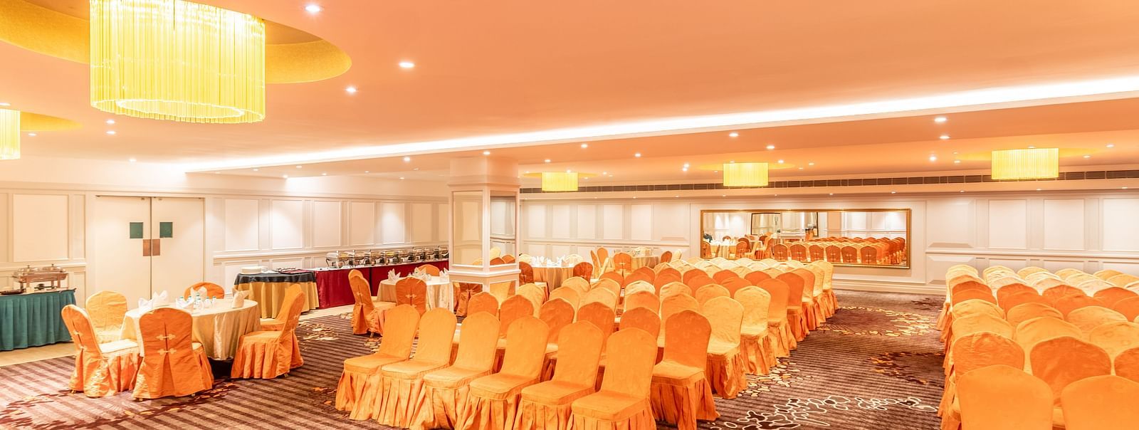 Spacious hall set up in classroom-style seating, ideal for training sessions or workshops
