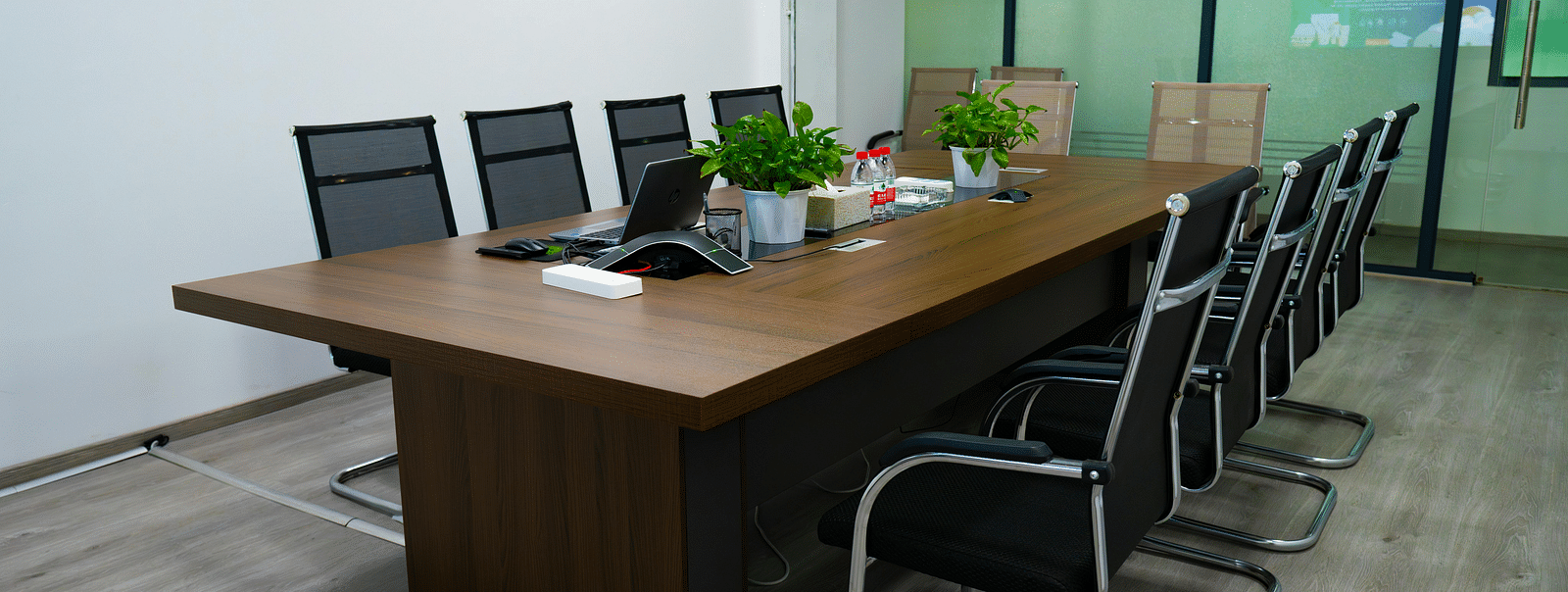 A boardroom with chairs and table
