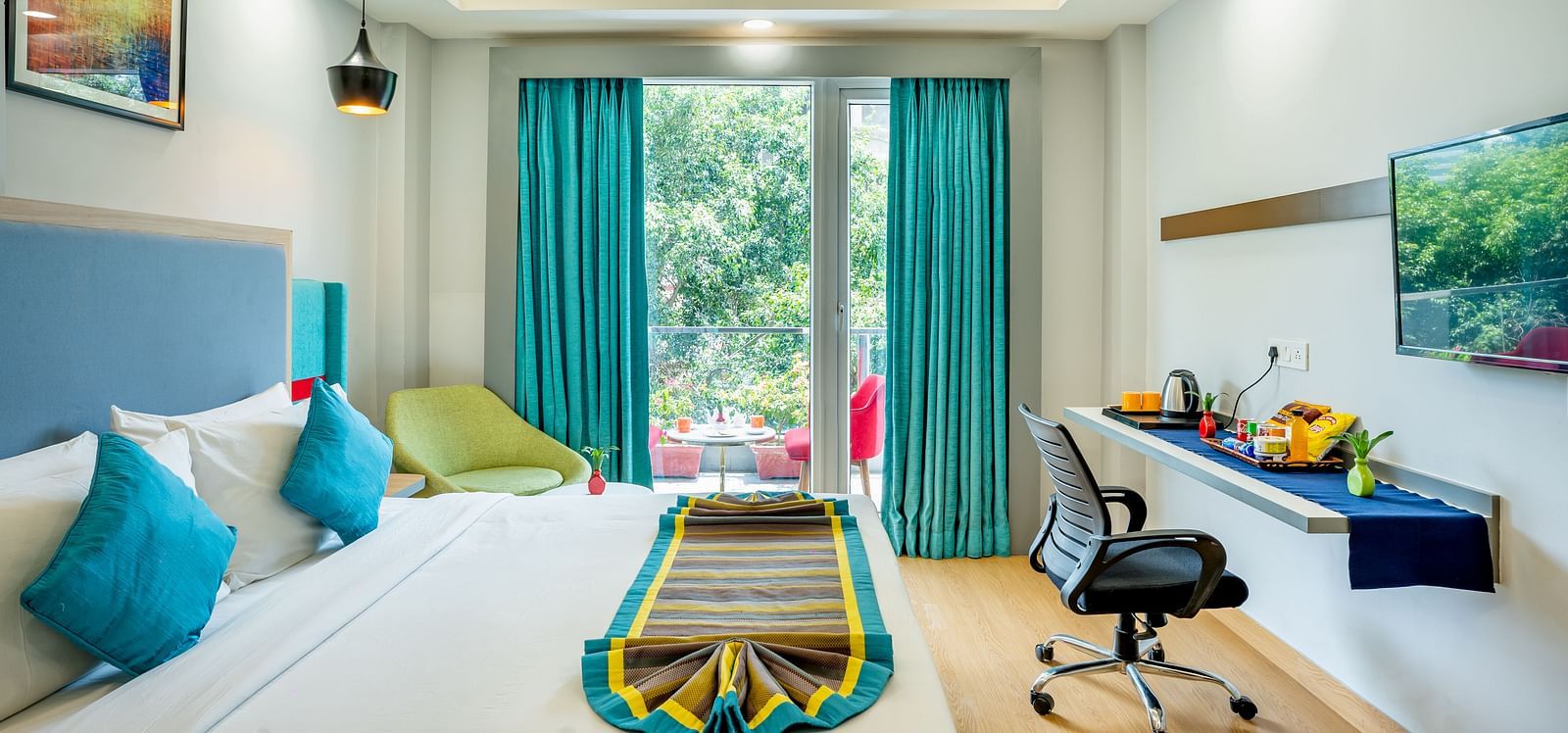 An image of a bedroom with balcony | Inde Hotel Golf Course Extension