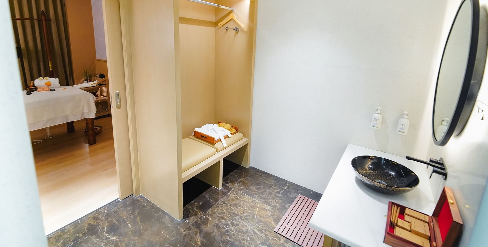 A serene spa treatment room with neatly arranged equipment and towels - Grand Madurai by GRT Hotels