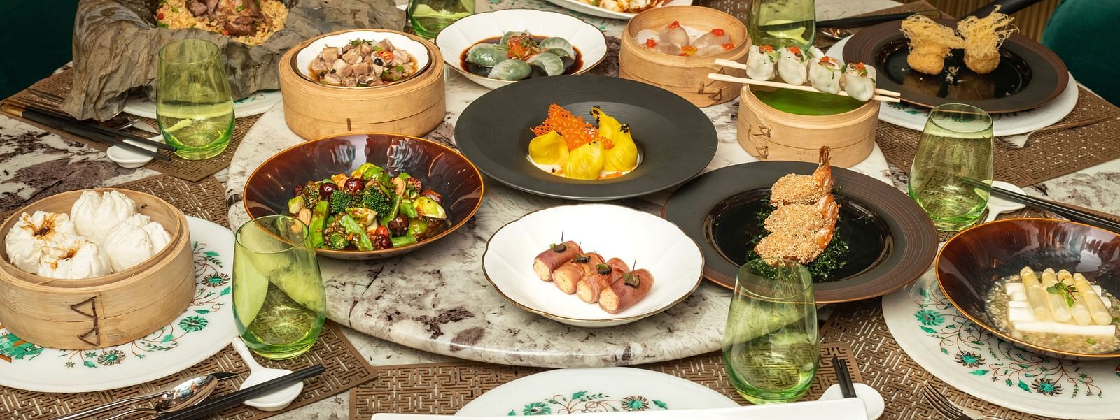 A wide array of dishes on a table at The Claridges New Delhi